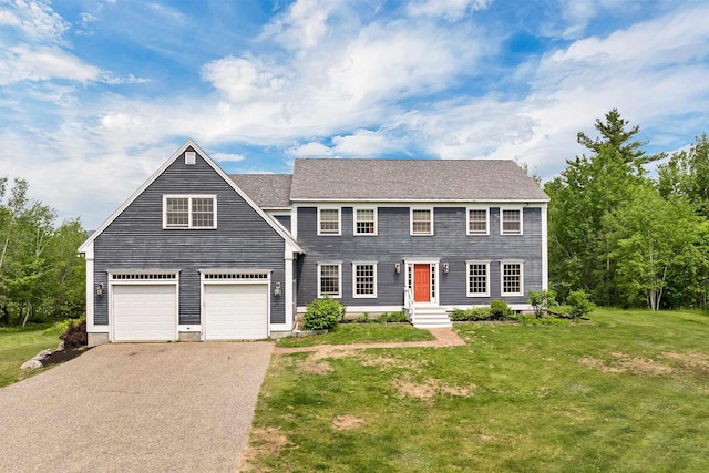 190 Ledge Hill Rd, Tuftonboro, NH 03816 - colonial home with asphalt driveway, a front yard, and a garage