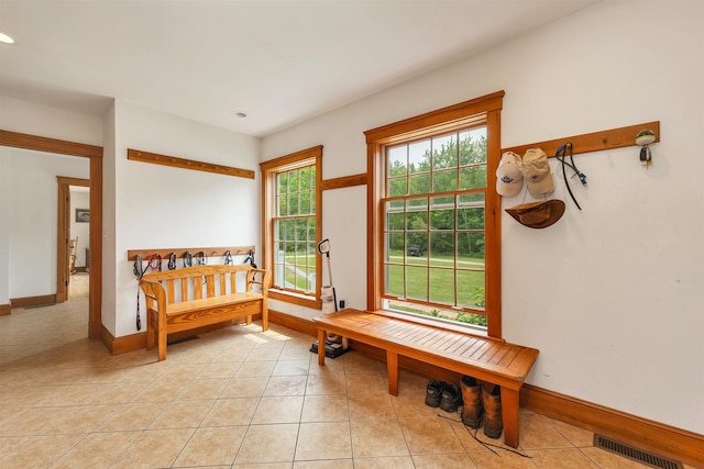 190 Ledge Hill Rd, Tuftonboro, NH 03816 - mudroom with baseboards and light tile patterned floors