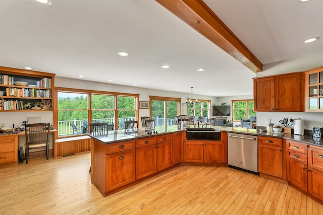 190 Ledge Hill Rd, Tuftonboro, NH 03816 - kitchen with dishwasher, a sink, light wood-style floors, brown cabinets, and dark stone countertops