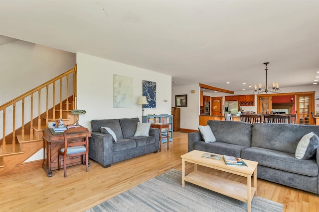190 Ledge Hill Rd, Tuftonboro, NH 03816 - living area with a chandelier, stairs, light wood-style flooring, and recessed lighting