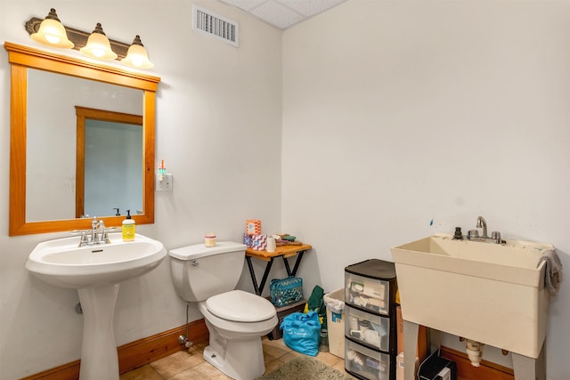 190 Ledge Hill Rd, Tuftonboro, NH 03816 - half bath featuring toilet, a sink, tile patterned flooring, and baseboards