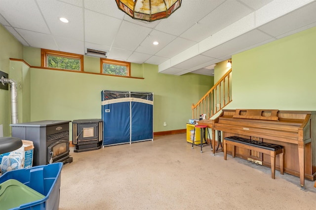 190 Ledge Hill Rd, Tuftonboro, NH 03816 - living area featuring a wood stove, a paneled ceiling, stairs, baseboards, and recessed lighting