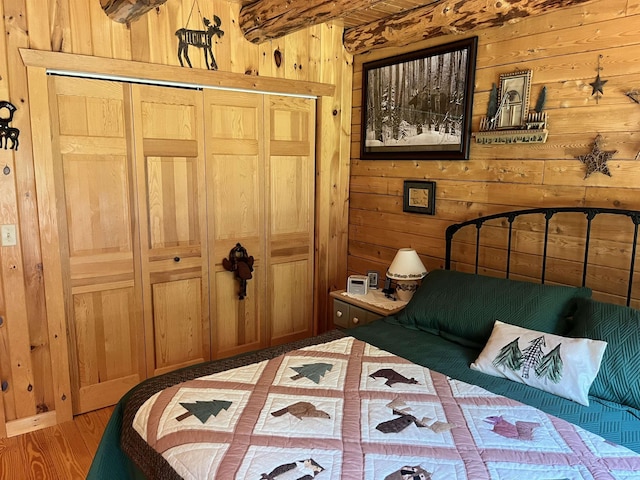 27 Stearns Ave, Wilmington, VT 05363 - bedroom with wooden walls and a closet