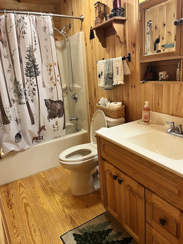 27 Stearns Ave, Wilmington, VT 05363 - full bathroom with vanity, wood walls, and shower / tub combo