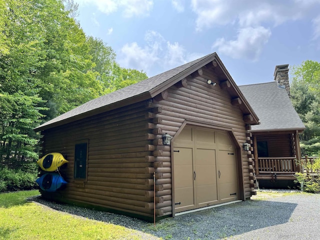 27 Stearns Ave, Wilmington, VT 05363 - view of home's exterior with log exterior, a chimney, a shingled roof, and driveway