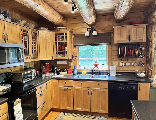 27 Stearns Ave, Wilmington, VT 05363 - kitchen featuring black appliances, a wooden ceiling with exposed beams, dark countertops, light wood-style flooring, and glass insert cabinets