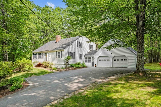 6 Bona Vista Dr, Bow, NH 03304 - view of front of house with asphalt driveway, a chimney, a garage, and roof with shingles