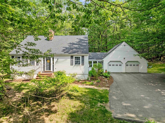 6 Bona Vista Dr, Bow, NH 03304 - view of front of home featuring a shingled roof, asphalt driveway, a garage, and a chimney