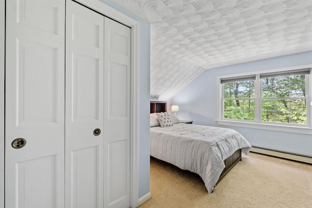 6 Bona Vista Dr, Bow, NH 03304 - bedroom featuring vaulted ceiling, a baseboard radiator, a closet, light colored carpet, and baseboards