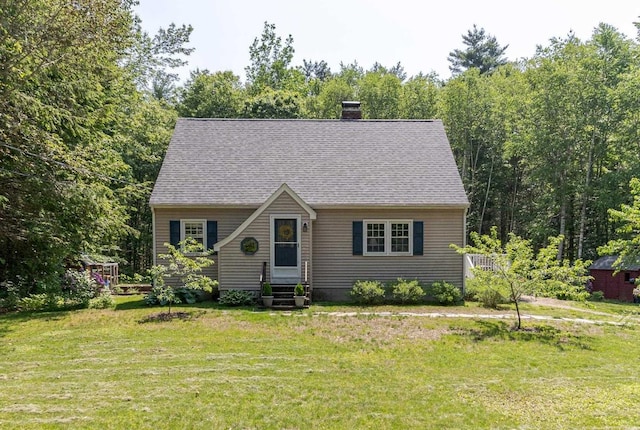 15 Allens Ave, Lee, NH 03861 - view of front facade with a front yard, a chimney, and entry steps