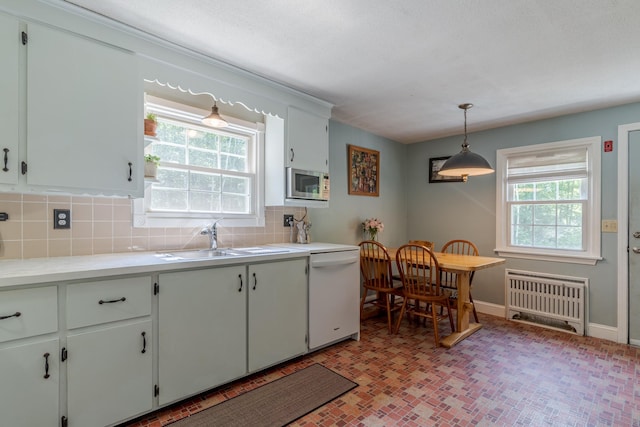 15 Allens Ave, Lee, NH 03861 - kitchen featuring white dishwasher, stainless steel microwave, a sink, radiator, and backsplash