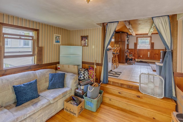 10 Mountain View Ter, Plymouth, NH 03264 - living room with a baseboard heating unit, wood finished floors, and wooden walls