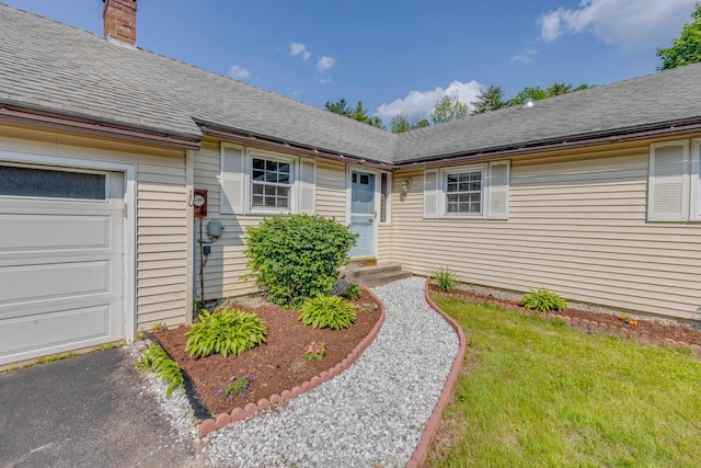 10 Mountain View Ter, Plymouth, NH 03264 - entrance to property with a chimney, an attached garage, a shingled roof, and a lawn