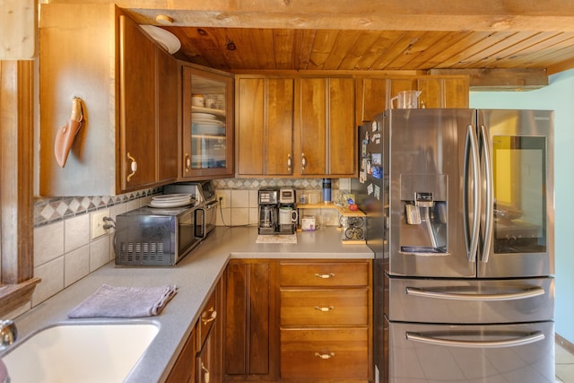 10 Mountain View Ter, Plymouth, NH 03264 - kitchen featuring stainless steel appliances, wood ceiling, brown cabinets, light countertops, and decorative backsplash