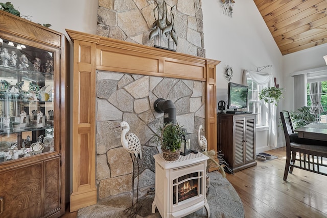 109 Temple Rd, Wilton, NH 03086 - living area featuring a wood stove, wood-type flooring, wooden ceiling, and high vaulted ceiling