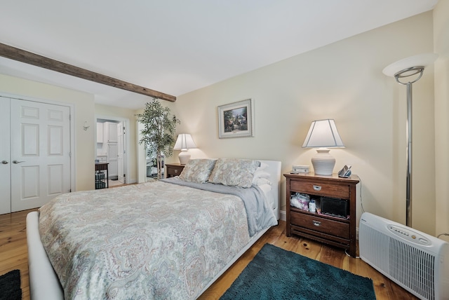 109 Temple Rd, Wilton, NH 03086 - bedroom featuring beamed ceiling, wood finished floors, a closet, and baseboards