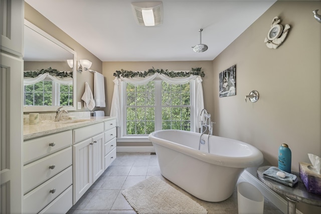 109 Temple Rd, Wilton, NH 03086 - bathroom with a soaking tub, vanity, tile patterned flooring, and baseboards