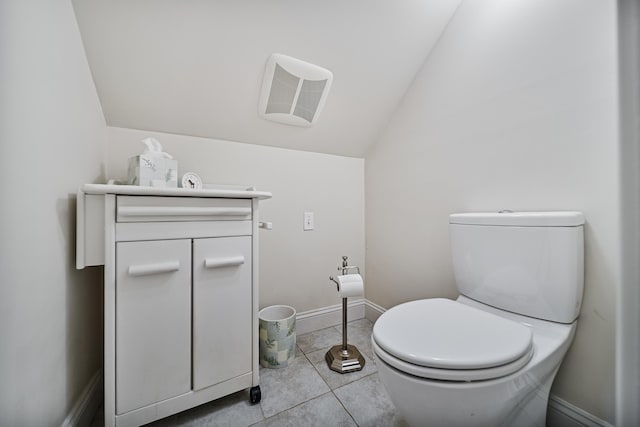 109 Temple Rd, Wilton, NH 03086 - half bathroom featuring lofted ceiling, toilet, tile patterned flooring, and vanity
