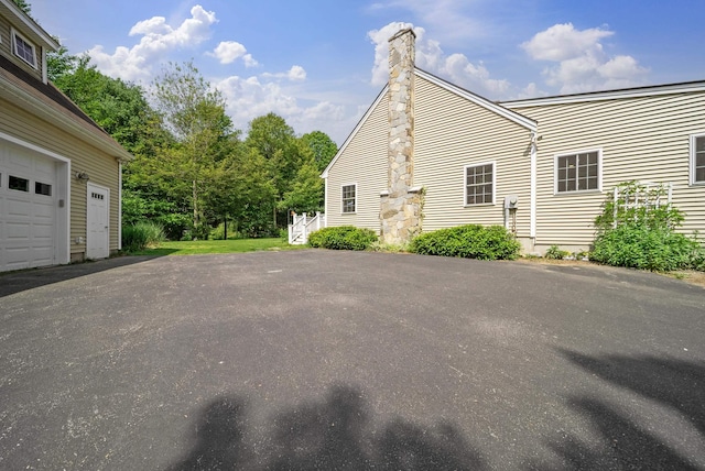 109 Temple Rd, Wilton, NH 03086 - view of side of property with a chimney and driveway