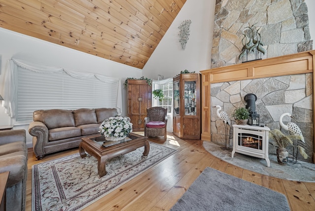 109 Temple Rd, Wilton, NH 03086 - living room featuring a wood stove, wood-type flooring, high vaulted ceiling, and wooden ceiling