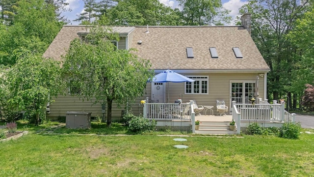 109 Temple Rd, Wilton, NH 03086 - back of house featuring roof with shingles, a wooden deck, and a lawn