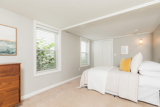191 Washington St Unit 1, Dover, NH 03820 - bedroom featuring light colored carpet, baseboards, and a closet