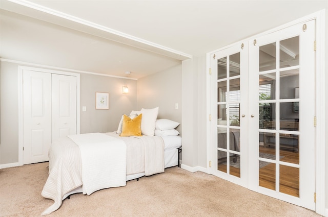 191 Washington St Unit 1, Dover, NH 03820 - carpeted bedroom with french doors, baseboards, and a closet