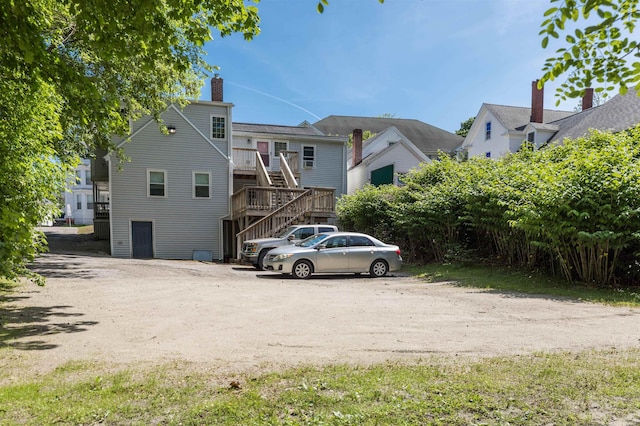 191 Washington St Unit 1, Dover, NH 03820 - back of property with stairs and a chimney