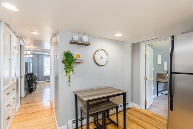 191 Washington St Unit 1, Dover, NH 03820 - hallway with light wood finished floors, baseboard heating, baseboards, and recessed lighting