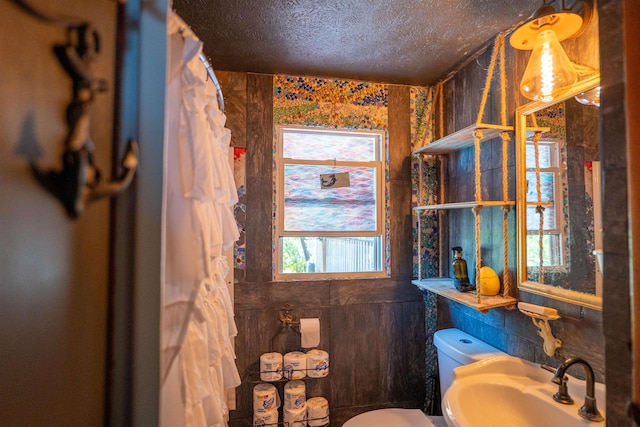 509 Cedar St, Manchester, NH 03103 - bathroom with a sink, toilet, a textured ceiling, and curtained shower