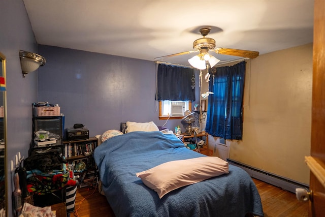 509 Cedar St, Manchester, NH 03103 - bedroom featuring baseboard heating, wood finished floors, cooling unit, and a ceiling fan