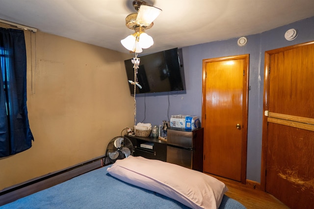 509 Cedar St, Manchester, NH 03103 - bedroom featuring baseboards and wood finished floors