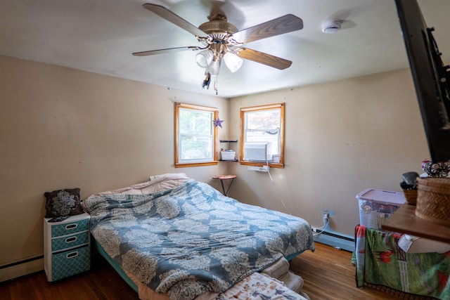 509 Cedar St, Manchester, NH 03103 - bedroom with baseboard heating, a baseboard radiator, wood finished floors, a ceiling fan, and baseboards