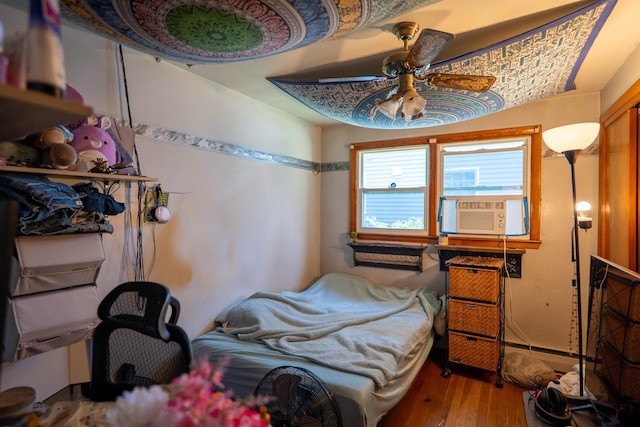 509 Cedar St, Manchester, NH 03103 - bedroom with cooling unit, wood finished floors, and a ceiling fan