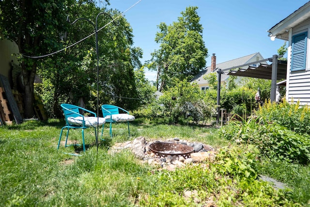 509 Cedar St, Manchester, NH 03103 - view of yard with an outdoor fire pit and a pergola