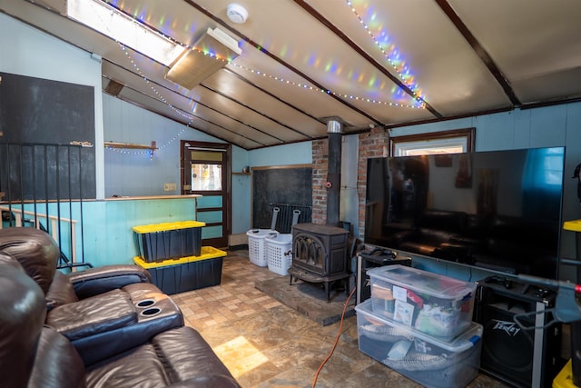 509 Cedar St, Manchester, NH 03103 - living room featuring a wood stove and vaulted ceiling