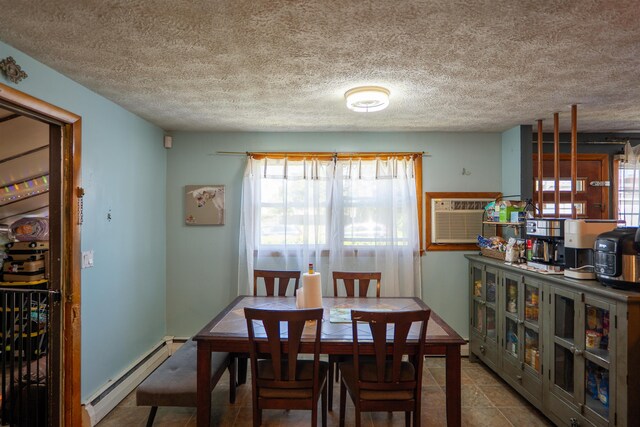509 Cedar St, Manchester, NH 03103 - dining space featuring baseboard heating, an AC wall unit, plenty of natural light, a textured ceiling, and tile patterned floors