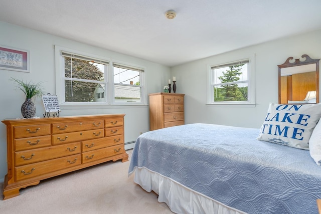 42 Bennett Bridge Rd, Northwood, NH 03261 - bedroom with multiple windows, light colored carpet, and a baseboard radiator