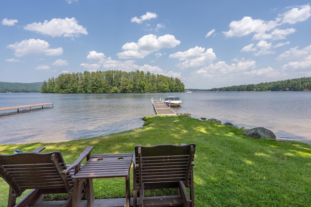 42 Bennett Bridge Rd, Northwood, NH 03261 - dock featuring a water view, a lawn, and a wooded view