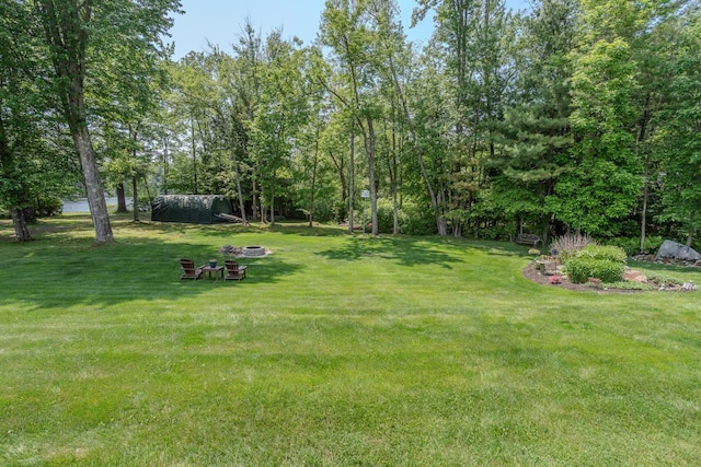 42 Bennett Bridge Rd, Northwood, NH 03261 - view of green lawn with a fire pit