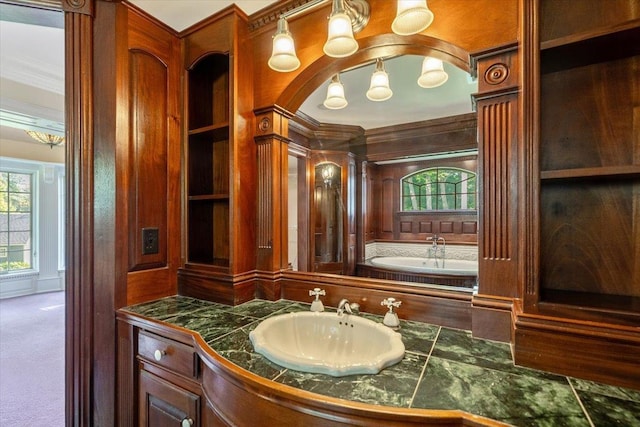 98 Sugar Maple Dr, Swanton, VT 05488 - bathroom featuring vanity, crown molding, built in shelves, and wooden walls