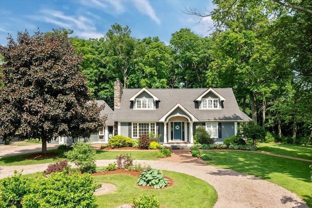 98 Sugar Maple Dr, Swanton, VT 05488 - cape cod-style house with a front yard and a chimney