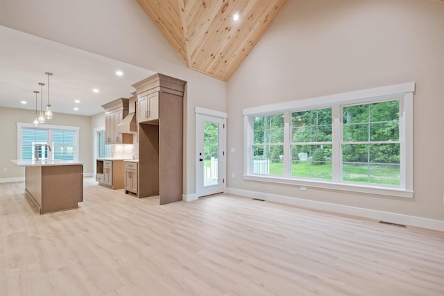 288 Sterling Dr, Laconia, NH 03249 - kitchen featuring recessed lighting, baseboards, an island with sink, light wood-style floors, and light countertops