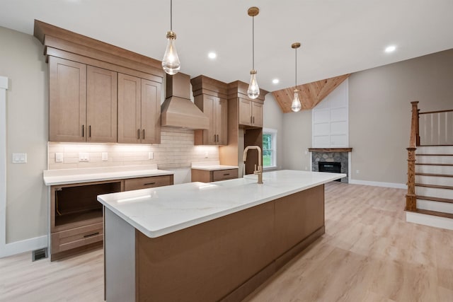 288 Sterling Dr, Laconia, NH 03249 - kitchen with premium range hood, baseboards, light wood-style floors, recessed lighting, and lofted ceiling