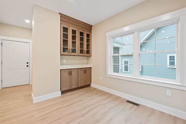 288 Sterling Dr, Laconia, NH 03249 - bar featuring light wood-style flooring, baseboards, and recessed lighting