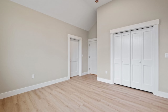 288 Sterling Dr, Laconia, NH 03249 - unfurnished bedroom featuring wood finished floors, baseboards, high vaulted ceiling, and a closet