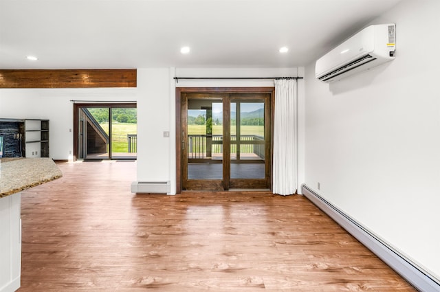 210 Field Rd Unit 44, Stowe, VT 05672 - entryway featuring a wall mounted air conditioner, a baseboard radiator, baseboard heating, light wood-type flooring, and recessed lighting