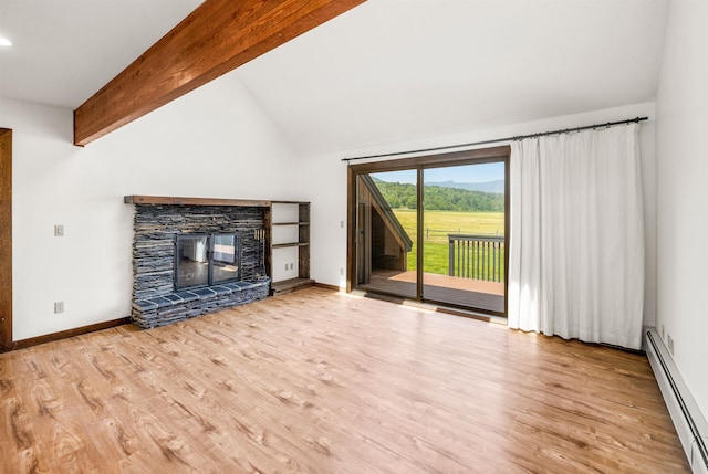 210 Field Rd Unit 44, Stowe, VT 05672 - unfurnished living room with a baseboard heating unit, wood finished floors, baseboards, and a stone fireplace