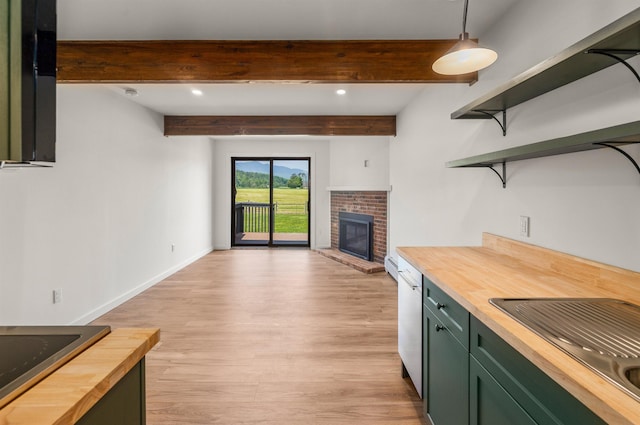 210 Field Rd Unit 44, Stowe, VT 05672 - kitchen with wooden counters, green cabinets, light wood-style flooring, a fireplace, and beamed ceiling
