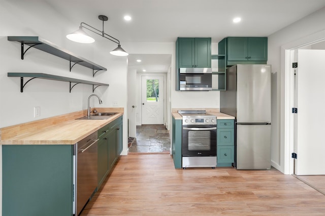 210 Field Rd Unit 44, Stowe, VT 05672 - kitchen featuring stainless steel appliances, a sink, green cabinets, open shelves, and recessed lighting
